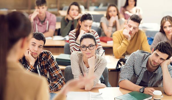 Students listening to lecture in class and trying to stay focused.