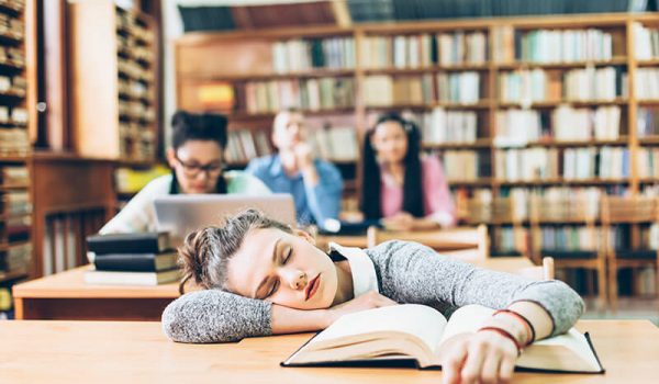 Student sleeping after studying