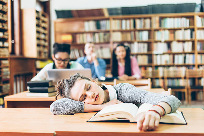 Student sleeping after studying