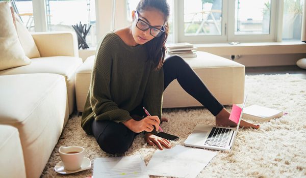 Young female studying in student house