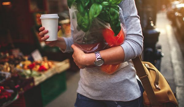 Female student carrying groceries