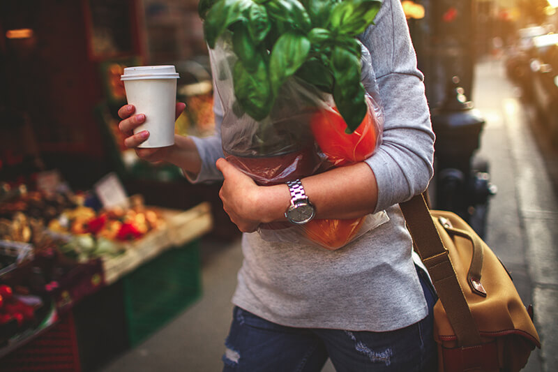 Female student carrying groceries