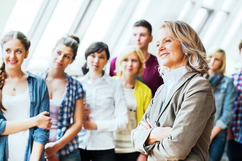 Female professor with group of students