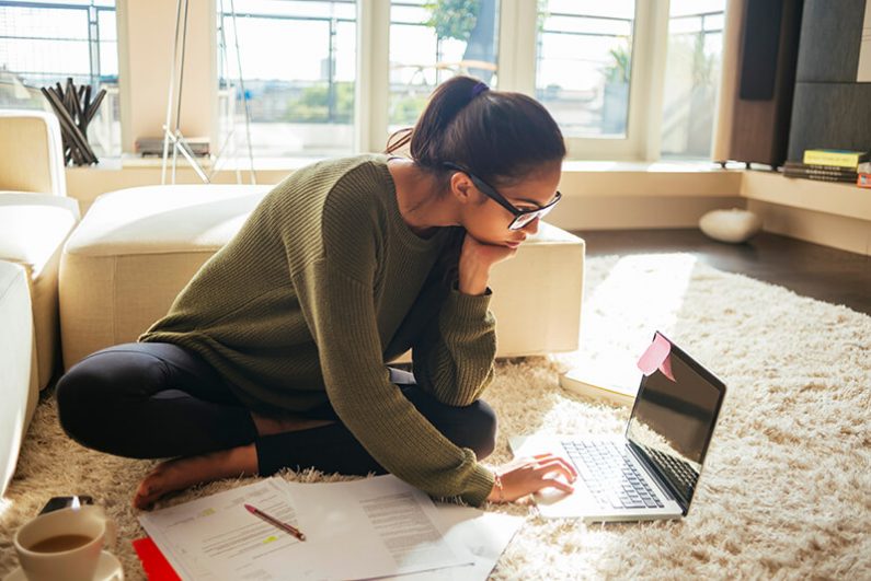 Young professional writing a resume