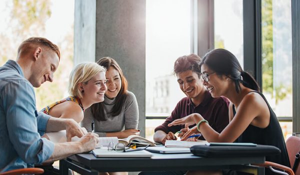 Friends in college laughing together