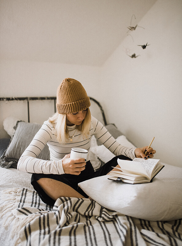 Girl reading and studying on bed