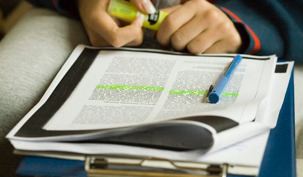 Student completing schoolwork for an exam