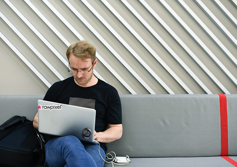 Man reading intensely on laptop