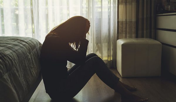 Young woman suffering from university anxiety and depression