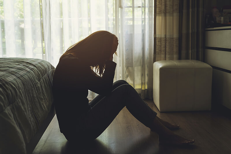 Young woman suffering from university anxiety and depression