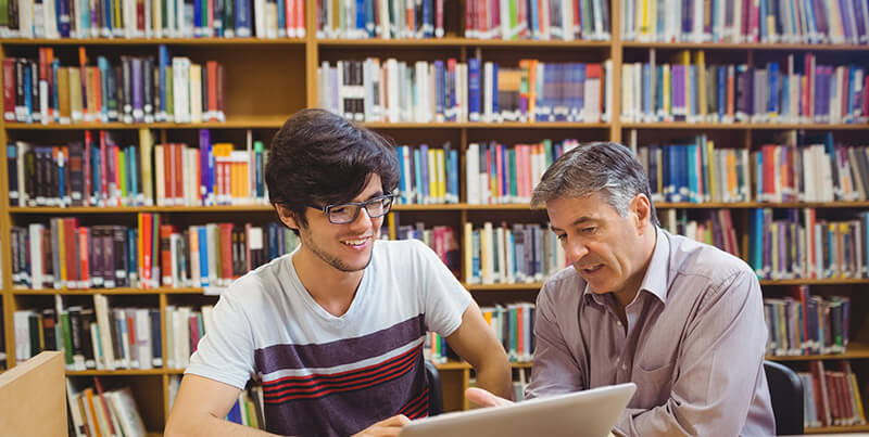 Student maximizing success at university talking to professor