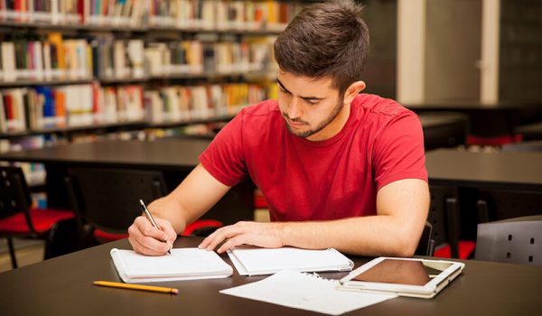 Student in the library developing good study habits