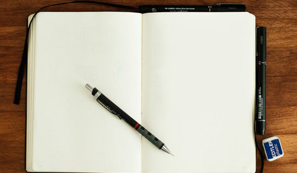A student’s blank notebook as they figure out how to write an essay