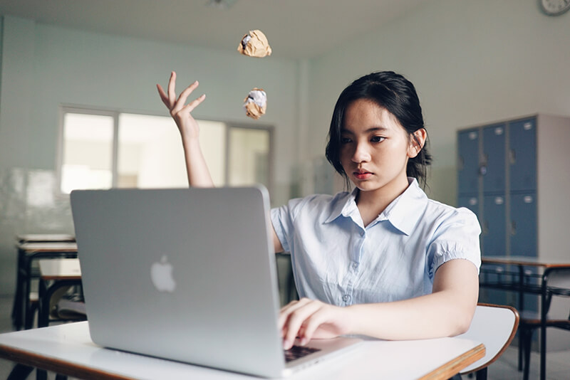 Female college student brainstorming for a research paper