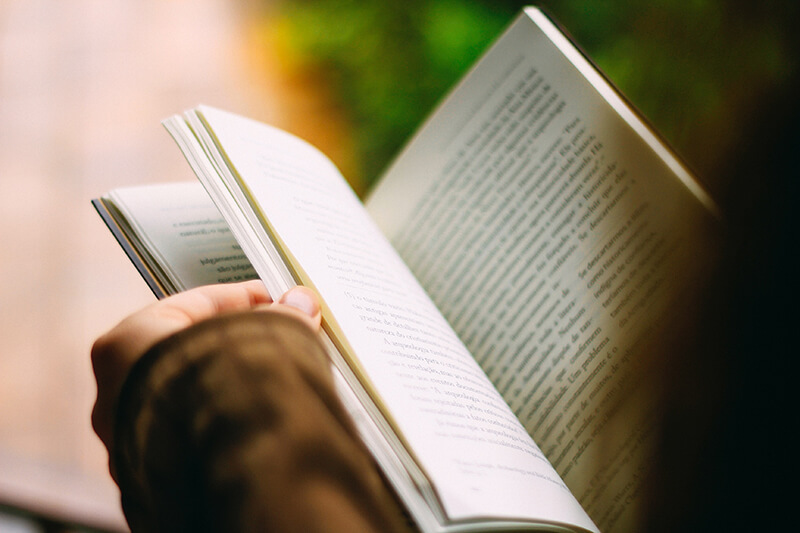 Flipping through an article in a book