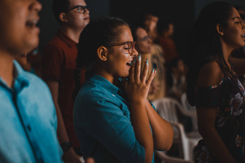 Student in speech audience listening intently