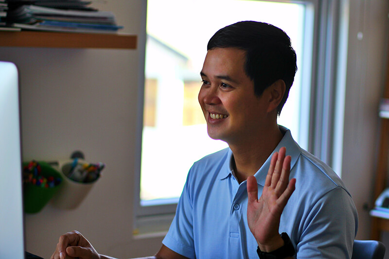 Young man participating in an online lecture