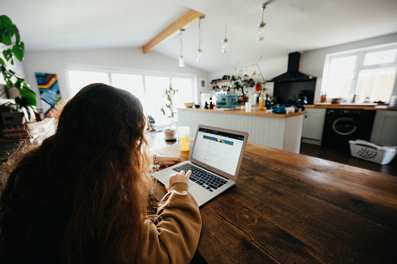 Young woman studying in the family kitchen