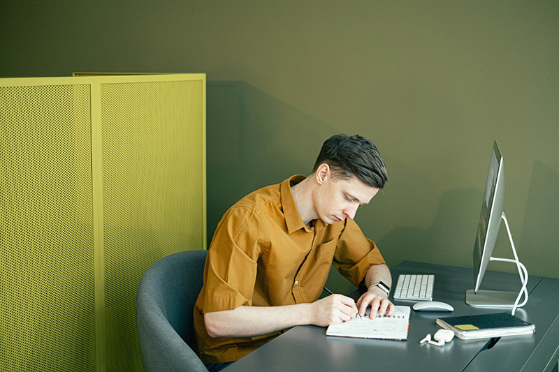 College student working on brainstorming speech ideas