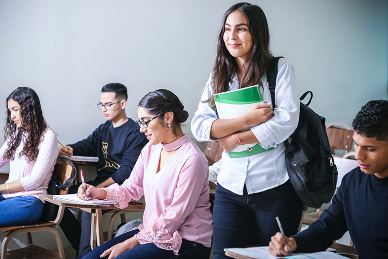 Female about to present her informative speech topics in class