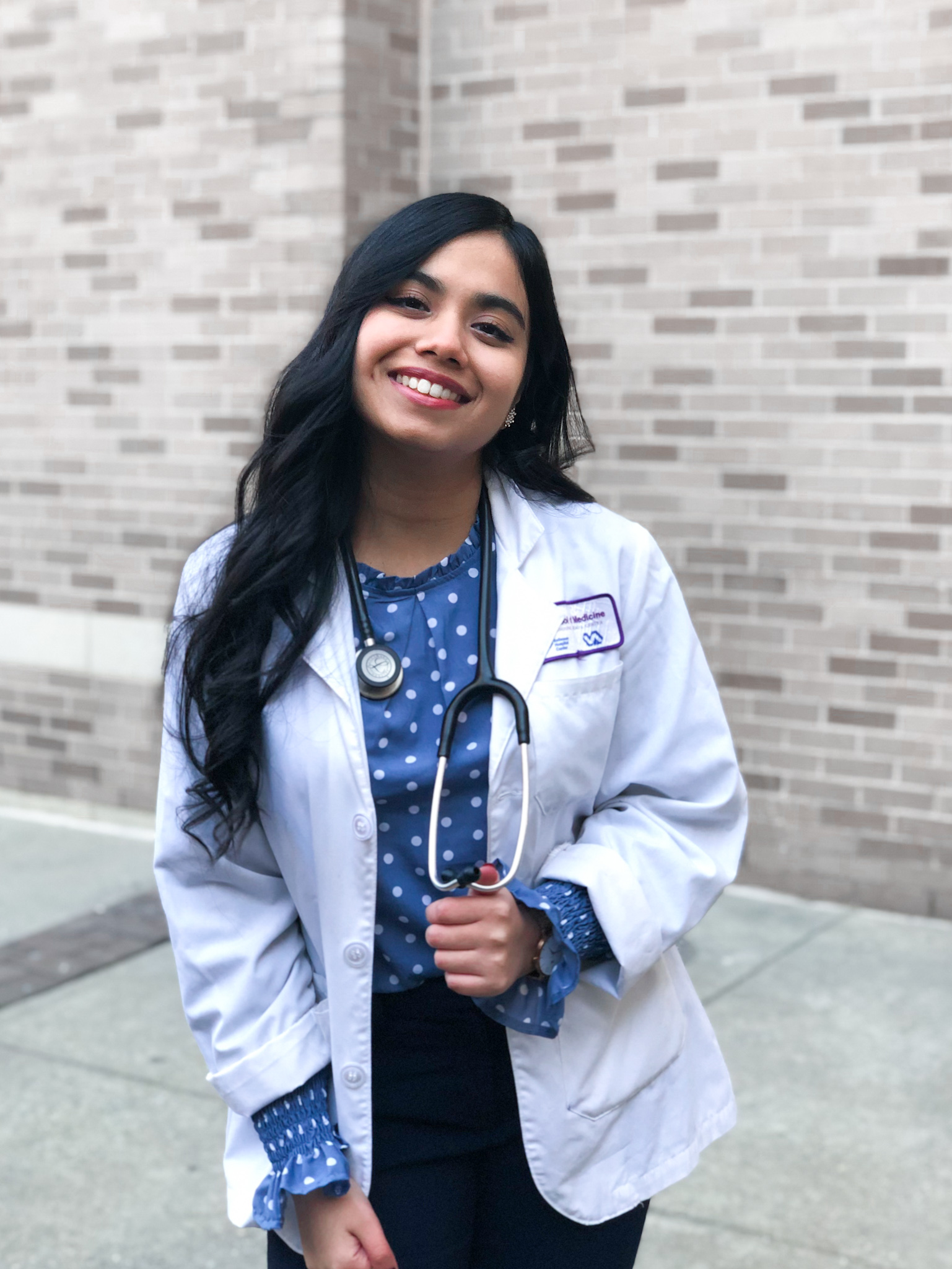 NYU Medical School student Qanetha Ahmed in her white coat