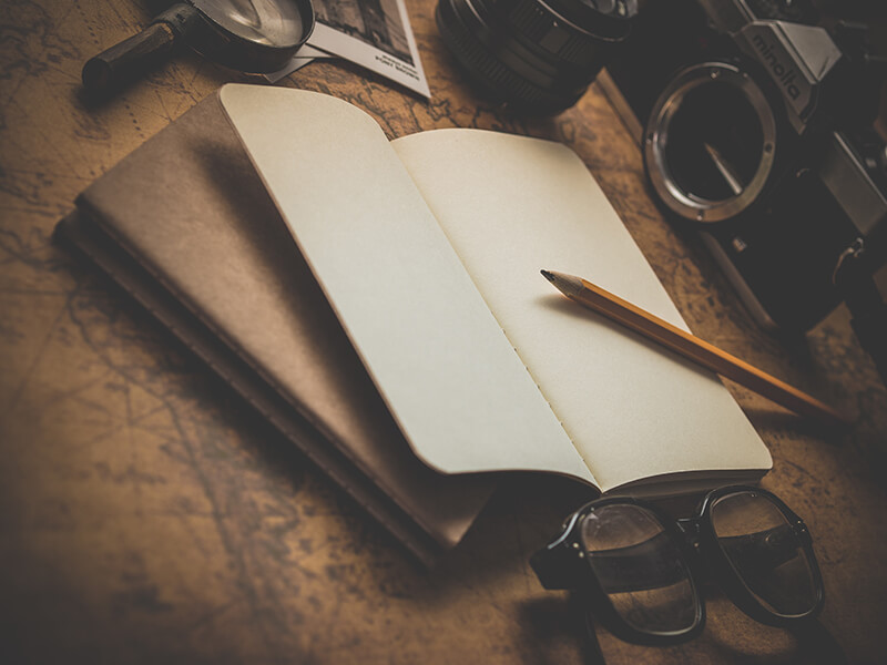 Antique book with glasses ready for writing practice