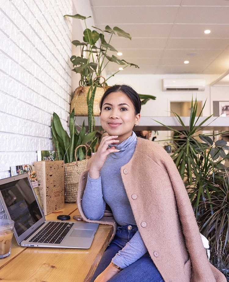 University of Toronto student Nathalee Pauline working on her side hustle in an office