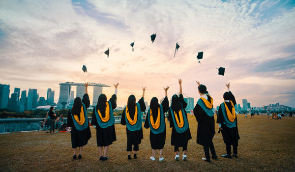 International students celebrating graduation at one of the top universities in the world