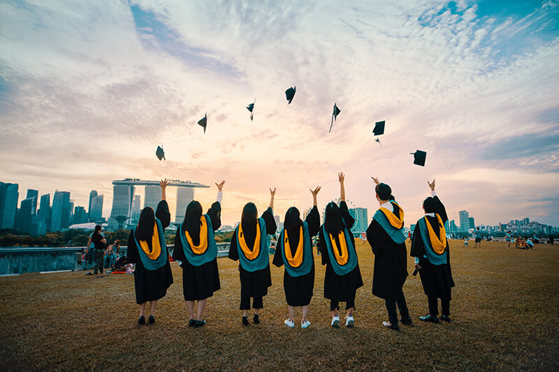 International students celebrating graduation at one of the top universities in the world