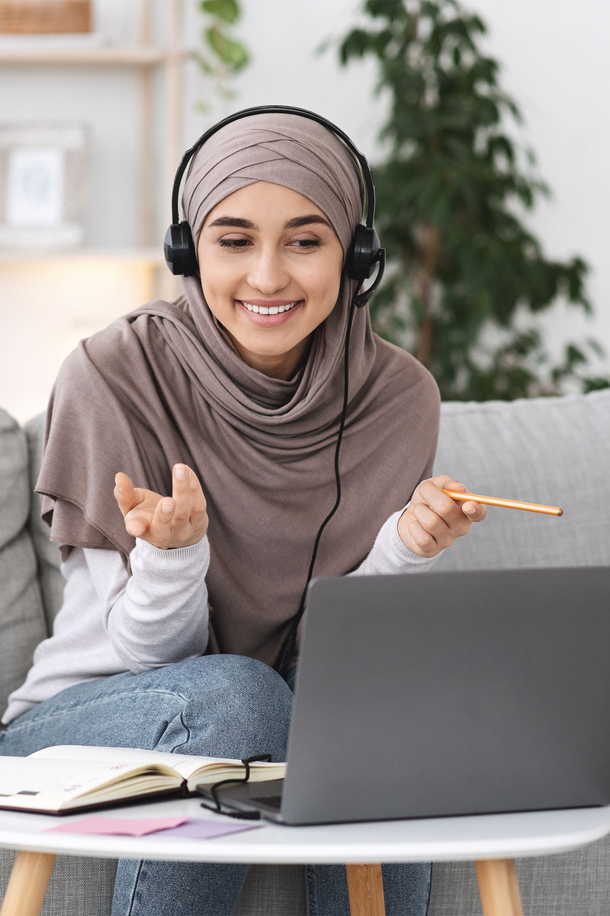 Student on headphones learning English