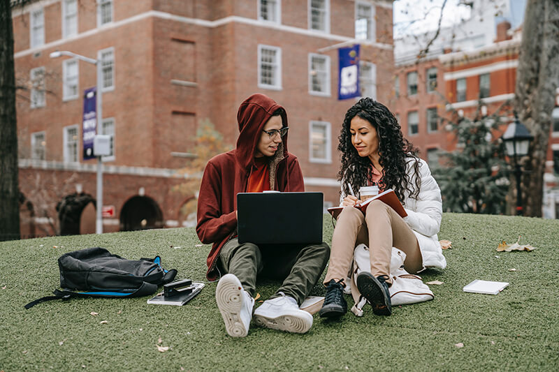 Students of an elite university studying together on the lawn