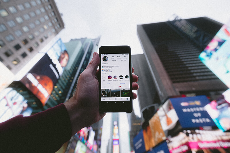 Person on vacation using phone to show social proof of travel