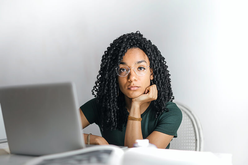 Female employee stuck while writing a professional email