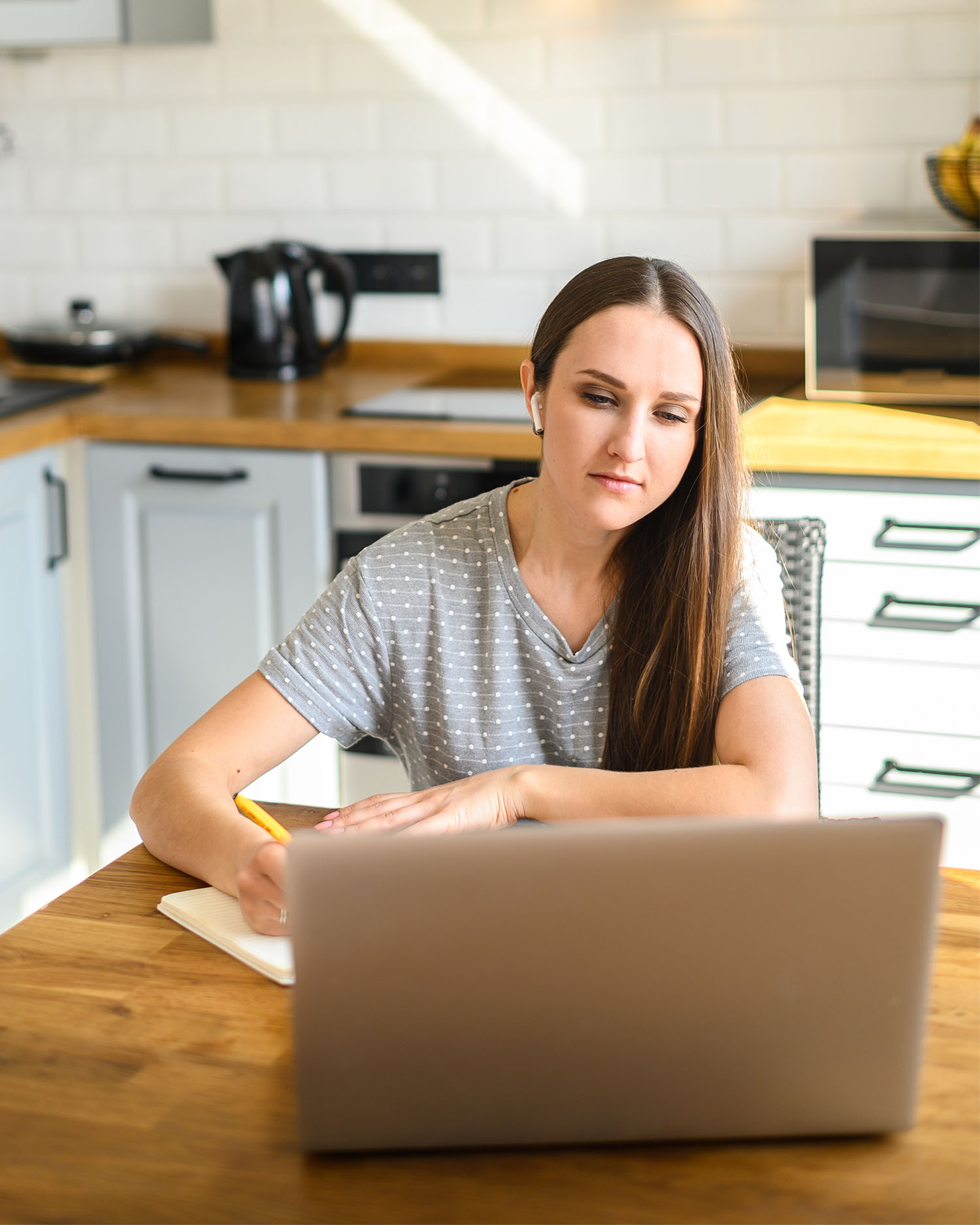 woman taking online spanish tutoring lessons at home