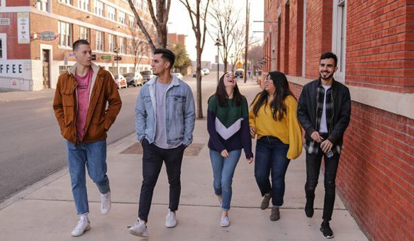 Students on campus learning how to make friends between classes