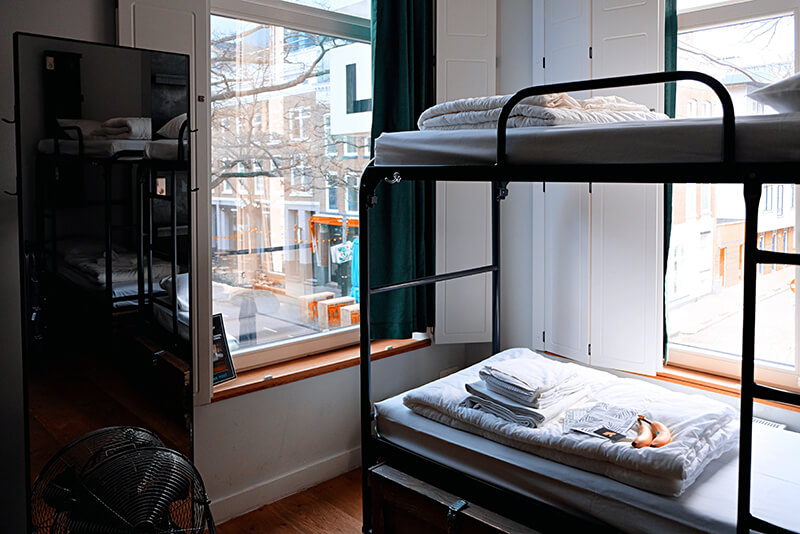 A college dorm room facing the street with a view of the city out front