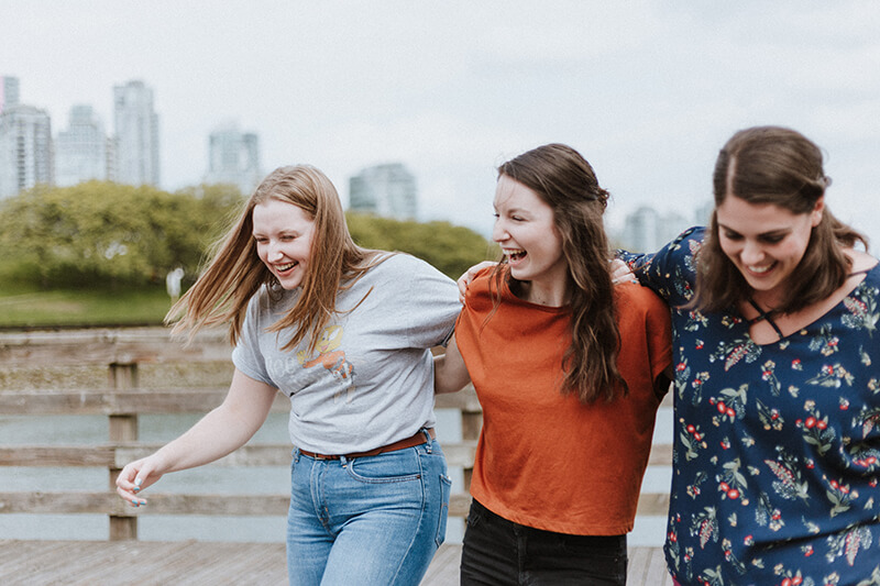 Sorority sisters enjoying student life while walking outside together