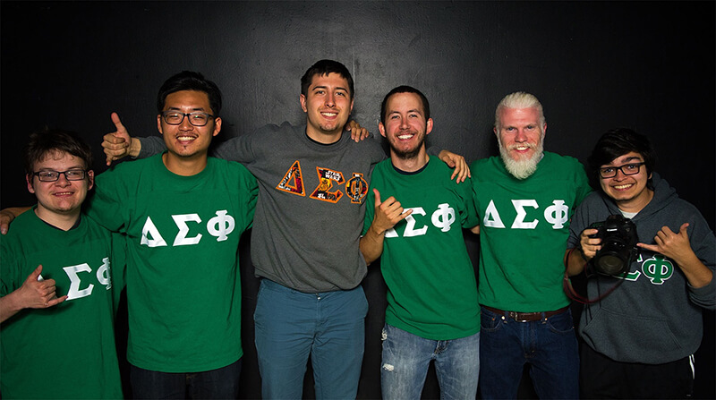 A group of fraternity brothers posing together at an event