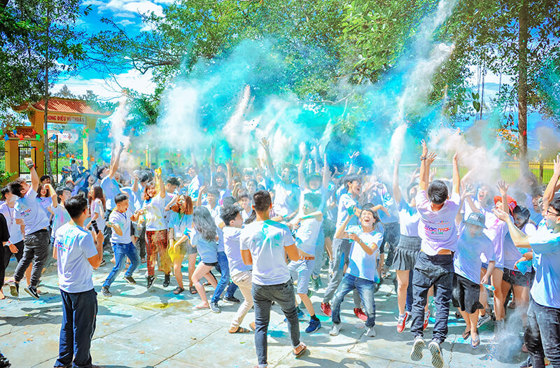 Male and female members of Greek life having a big paint party together outside