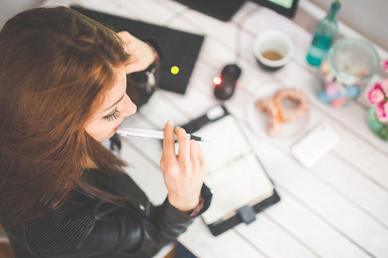 Female college student conducting brainstorming in the writing process