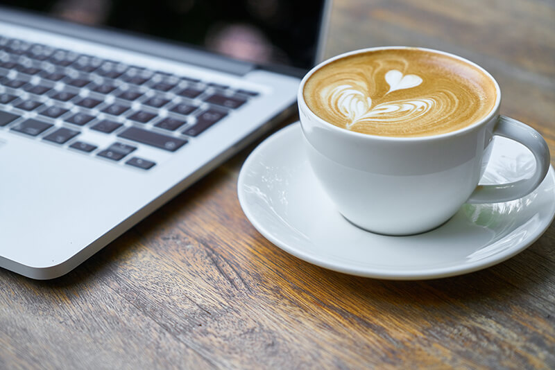 Student’s latte art being used as motivation to study in a coffee house