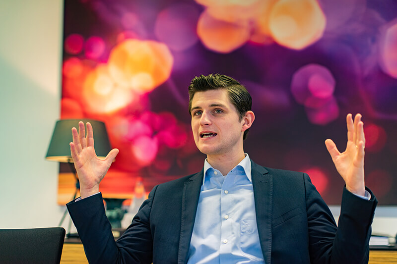 Male student in the middle of a speech delivery in class