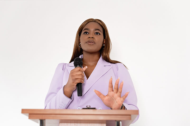 Female college student learning how to write a speech for her academic class