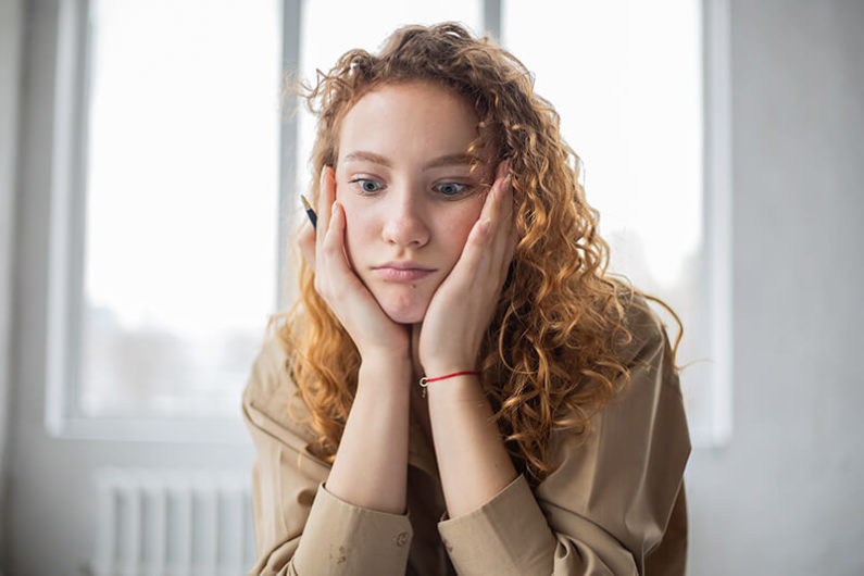 Female student learning how to motivate yourself to get on track at school