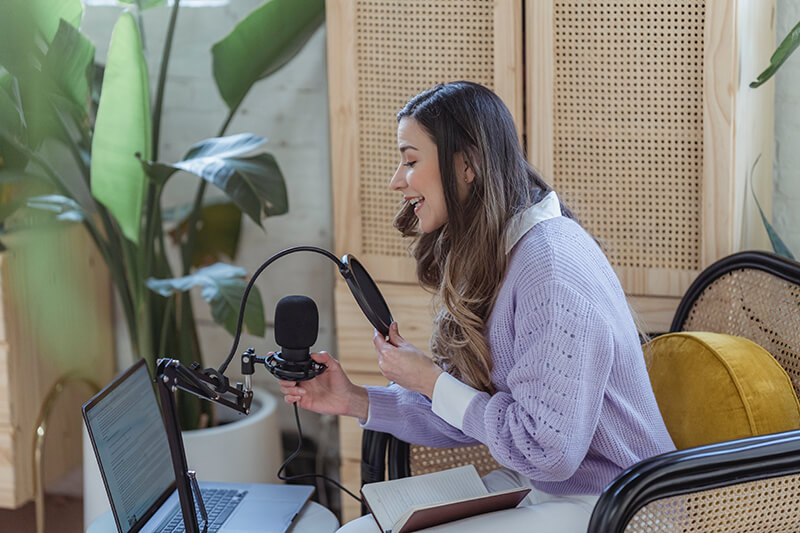 Female college student talking to her listeners on her podcast