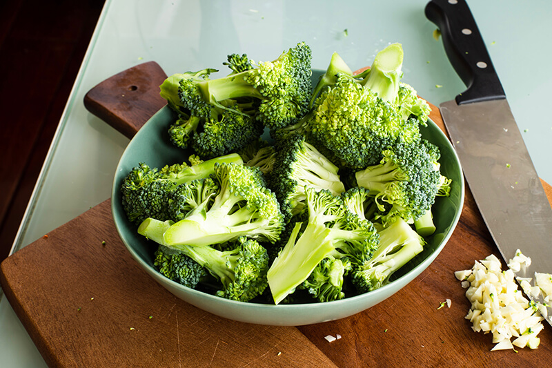 A bowl of broccoli ready to be eaten