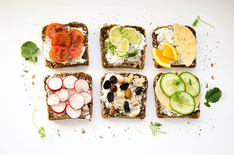Whole grain toast with different toppings for snack ideas