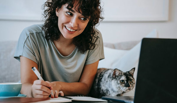 Female student happy to learn about a custom essay writing company