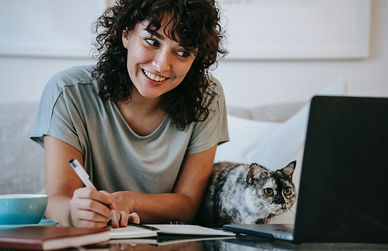 Female student happy to learn about a custom essay writing company