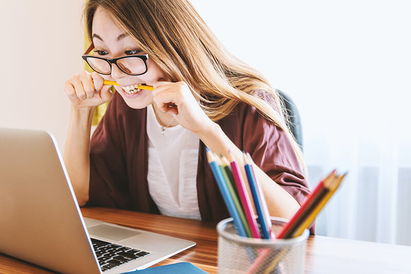 female student on her laptop researching